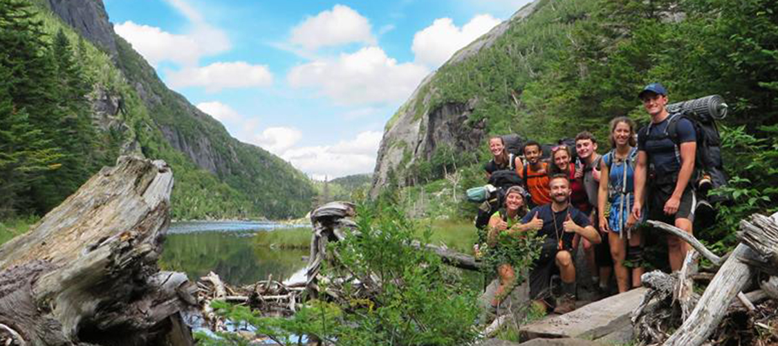 A group of backpackers at Avalanche Lake in the Adirondacks