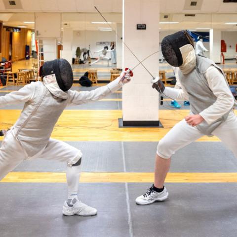 Cornell fencing students practice for a competition