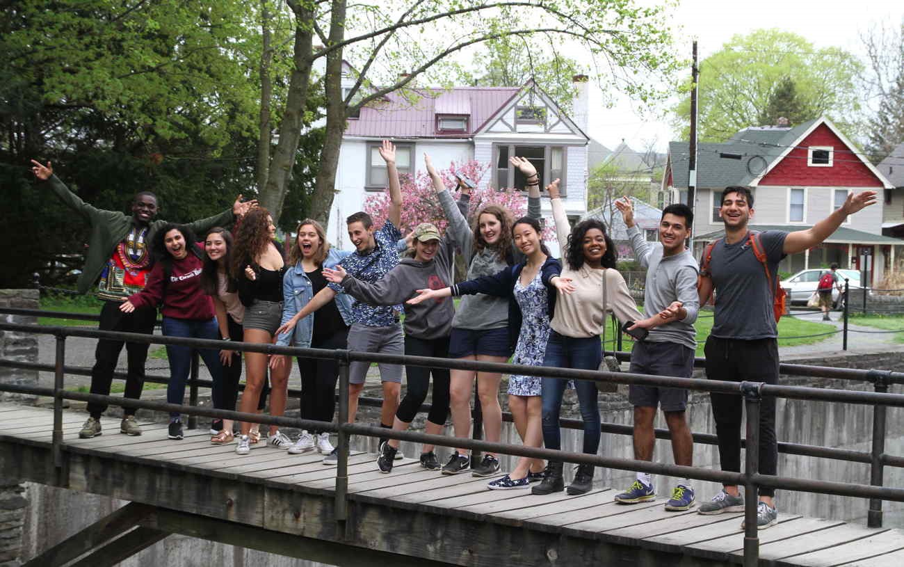 Tatkon Center Students Posing on a Bridge
