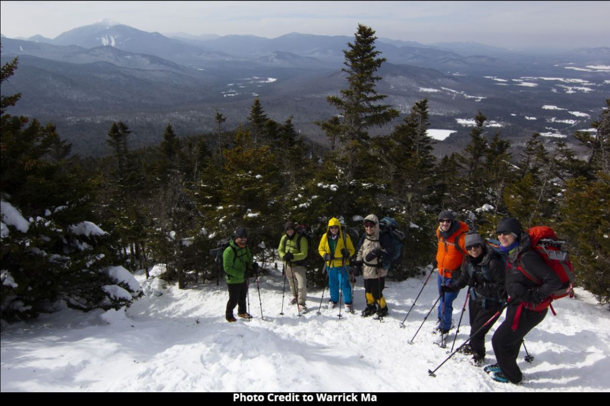 image of people on snowy mountain in New York