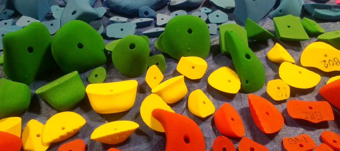 Freshly washed climbing holds are laid out to dry
