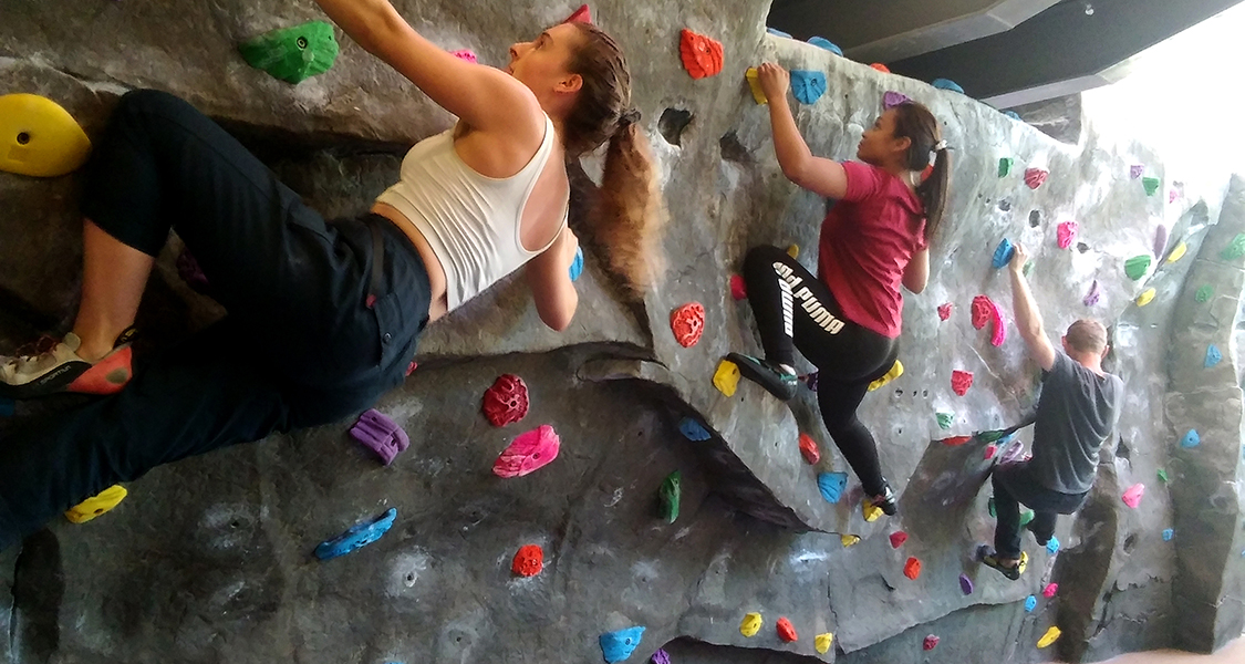 Climbers on the Noyes bouldering wall
