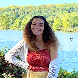 Sophia Johnson stands in front of Cayuga Lake