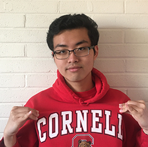 Wilson Shi wearing a red and white Cornell sweatshirt