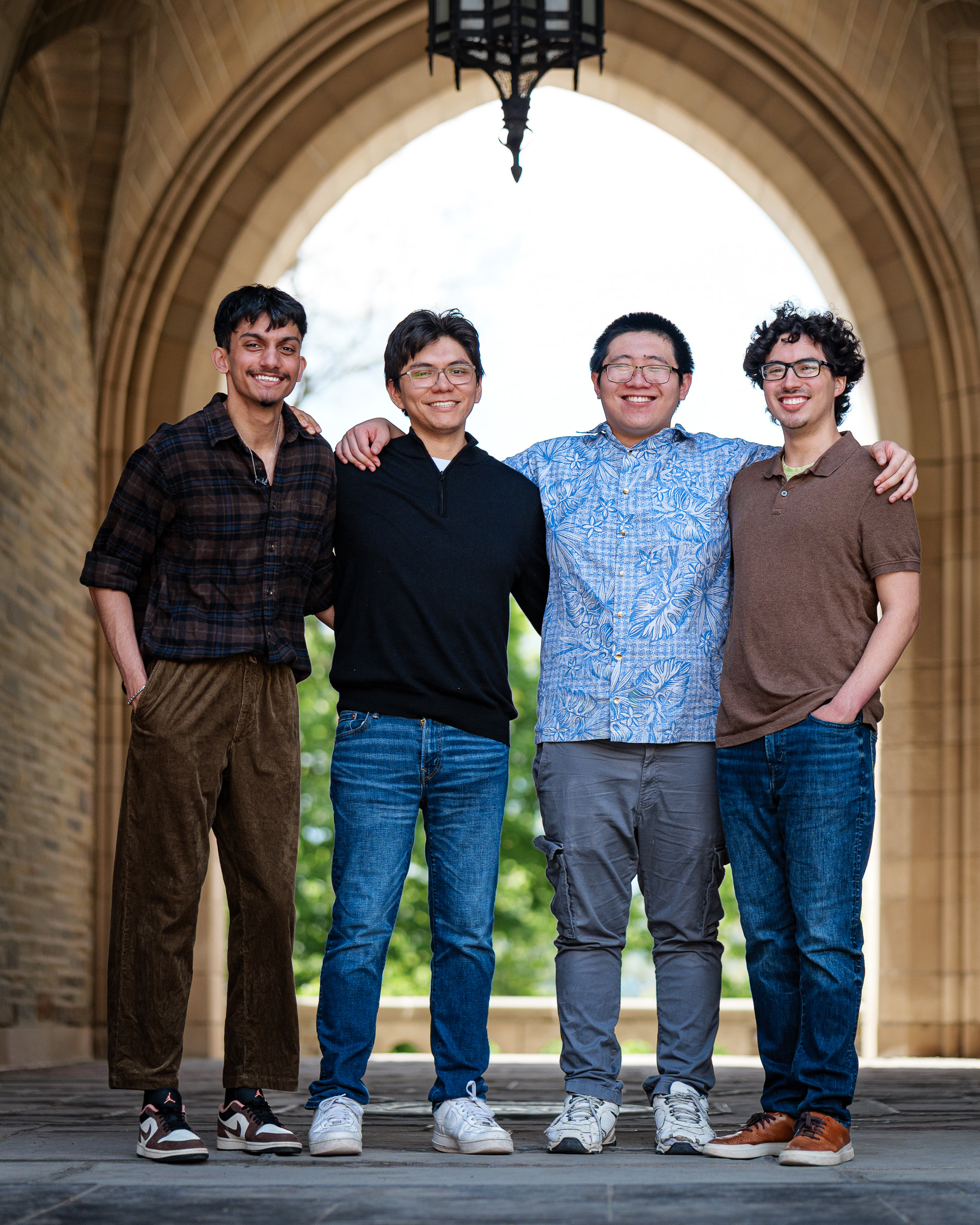 Seniors pose under the law school arches