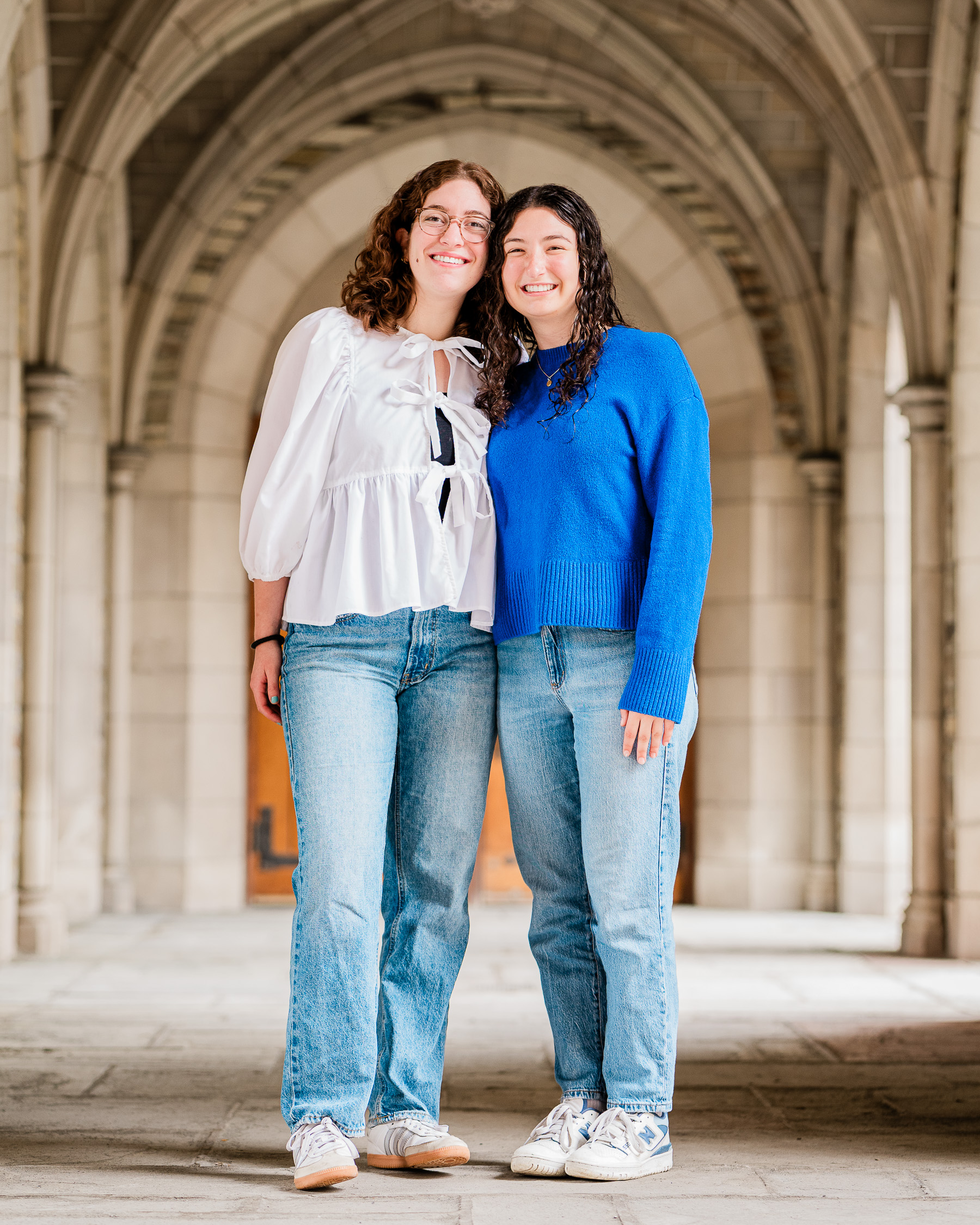 Students pose by Law School arches