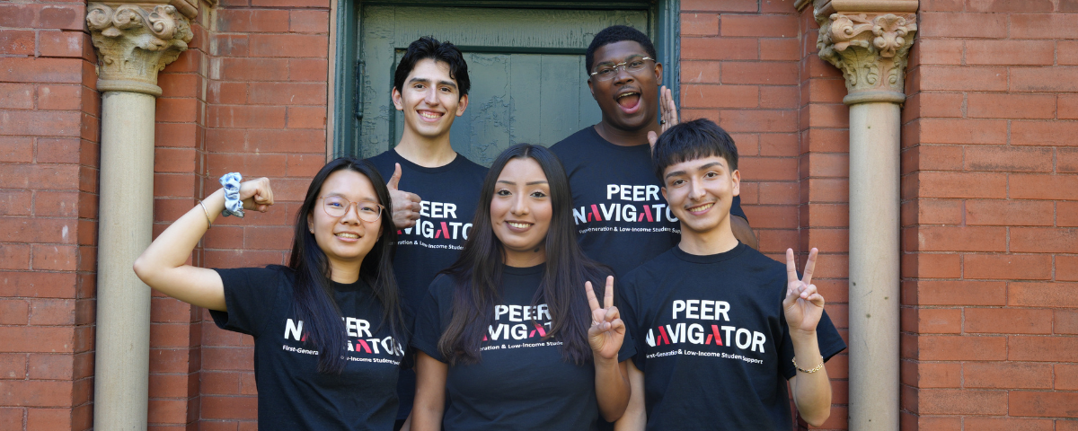 5 students pose wearing shirts that say "peer navigators"