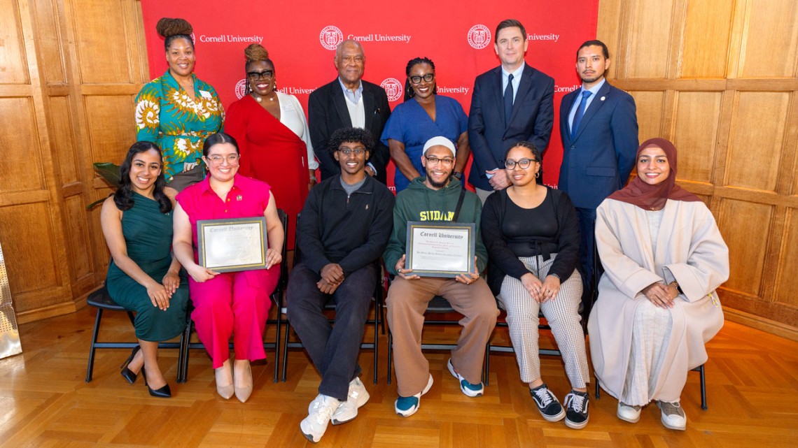 Student winners and honorable mentions of the 2024 James A. Perkins Prize for Interracial and Intercultural Peace and Harmony stand at this year’s ceremony with Cornell leadership and Cornell Trustee Emeritus Thomas W. Jones ’69, MRP ’72, standing, third from left, who endowed the Perkins Prize in 1994.