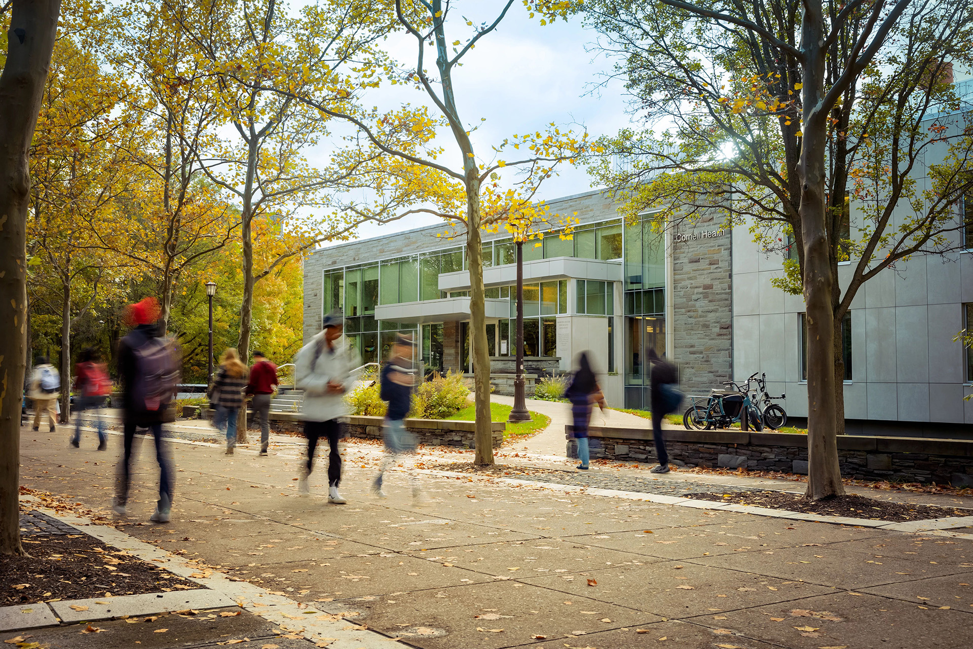 Students walk in front of Cornell Health