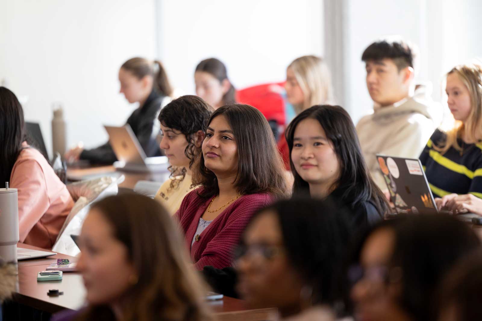 Student Sitting in a classroom Learning