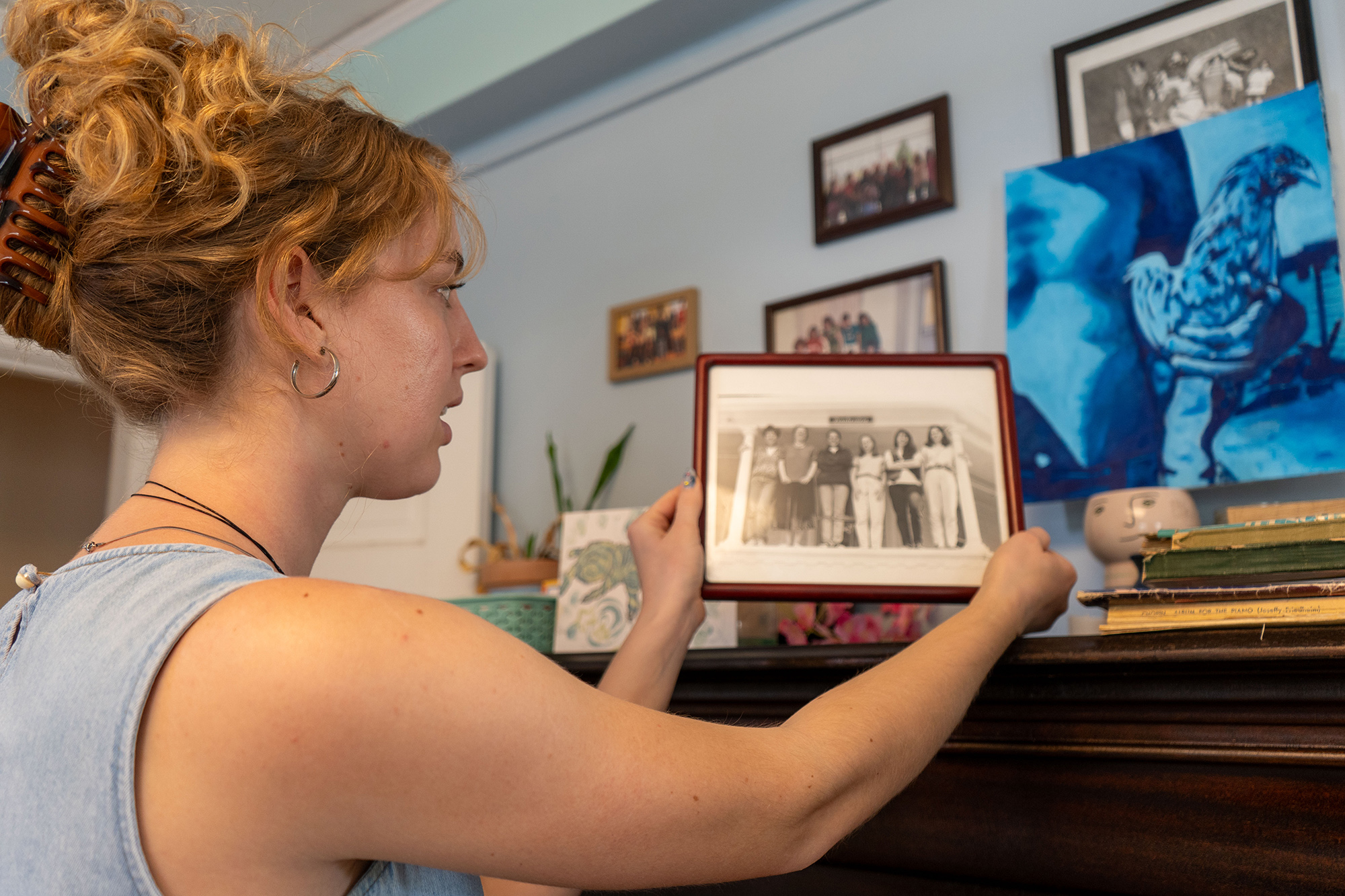 Julia Dahl '25 looks at a photo of former residents
