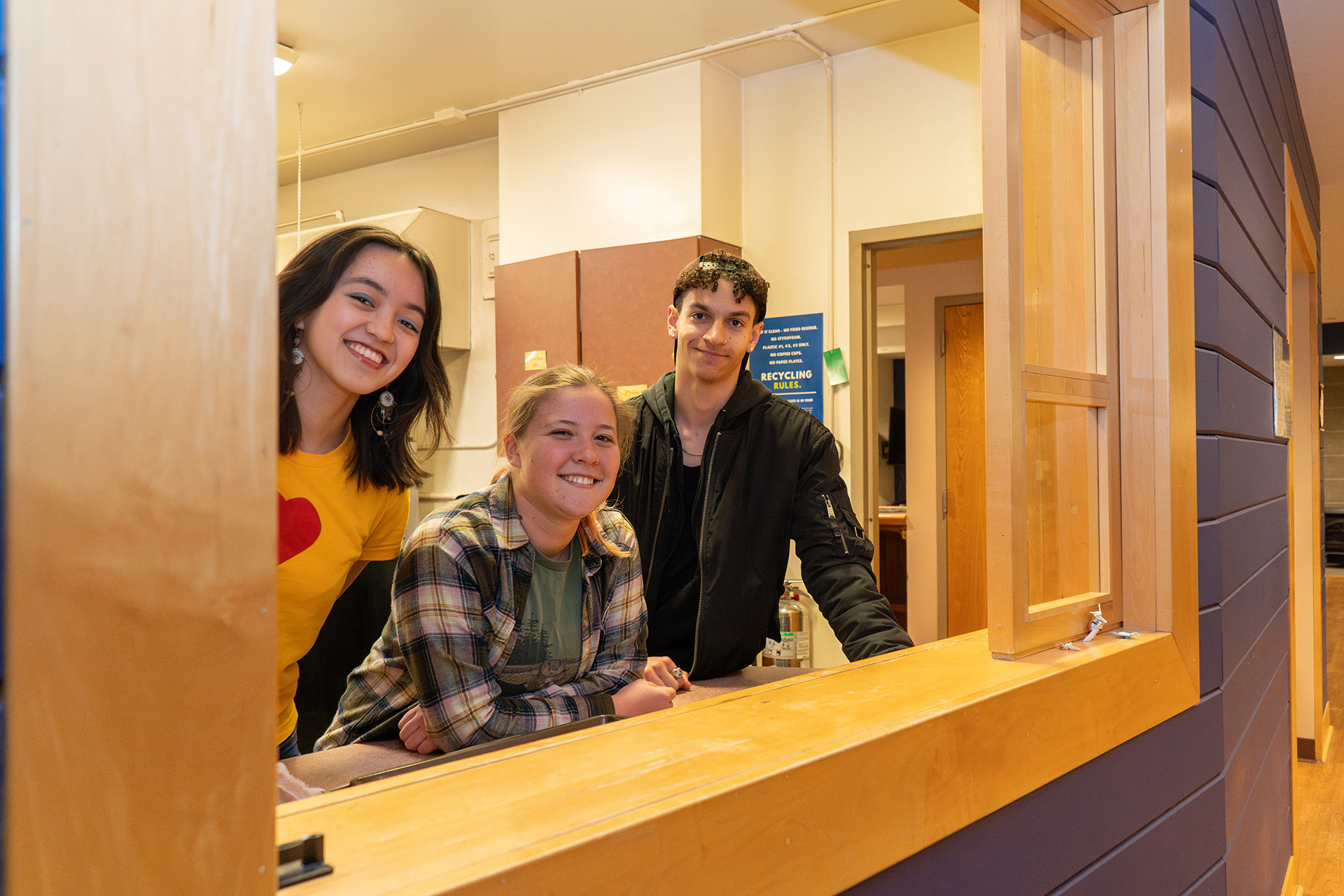 Residents pose for a photo inside of Eco House