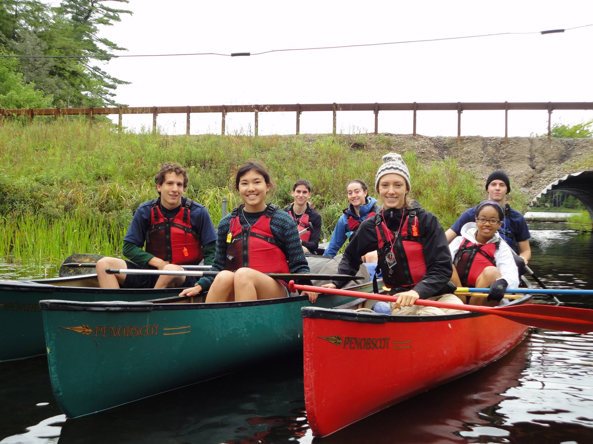 7 students in canoes