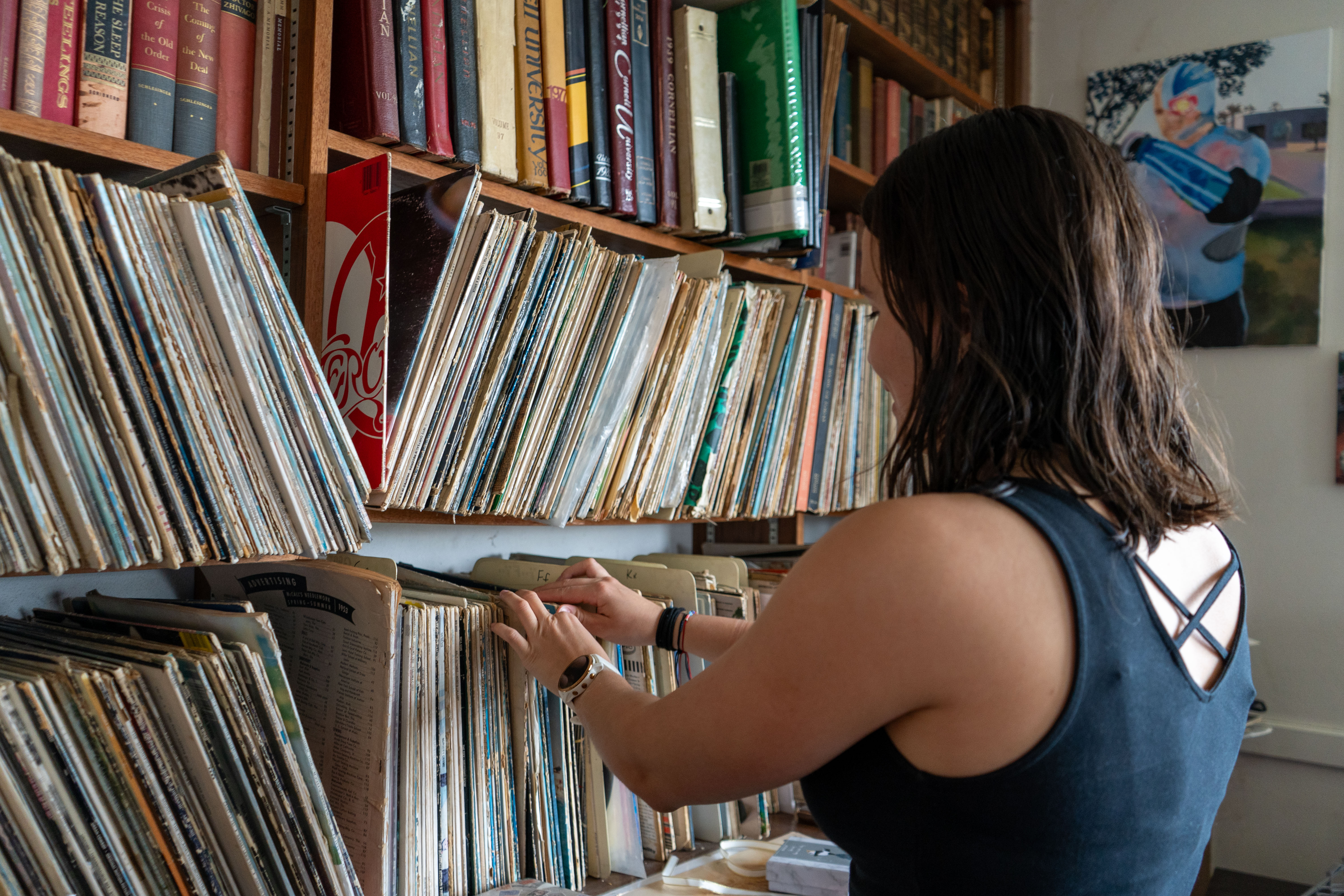 Raquel Soto looks through a record collection