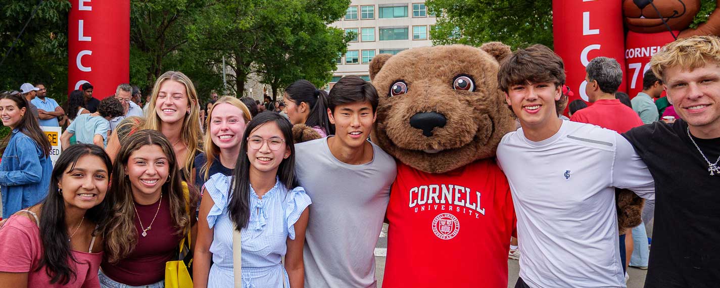 Touchdown posing with a group of students