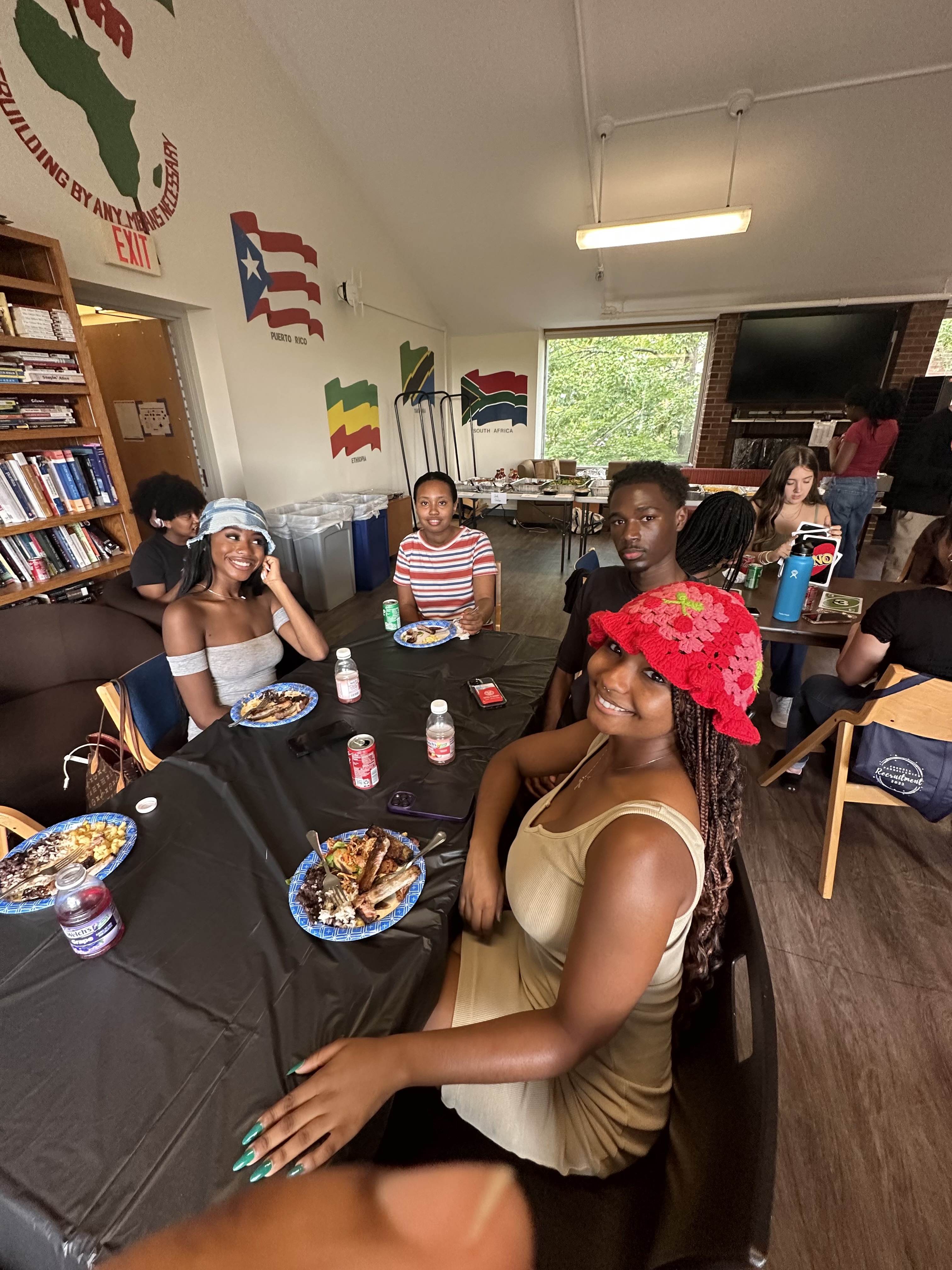 Photo of Ujamaa residents at an event with food and games