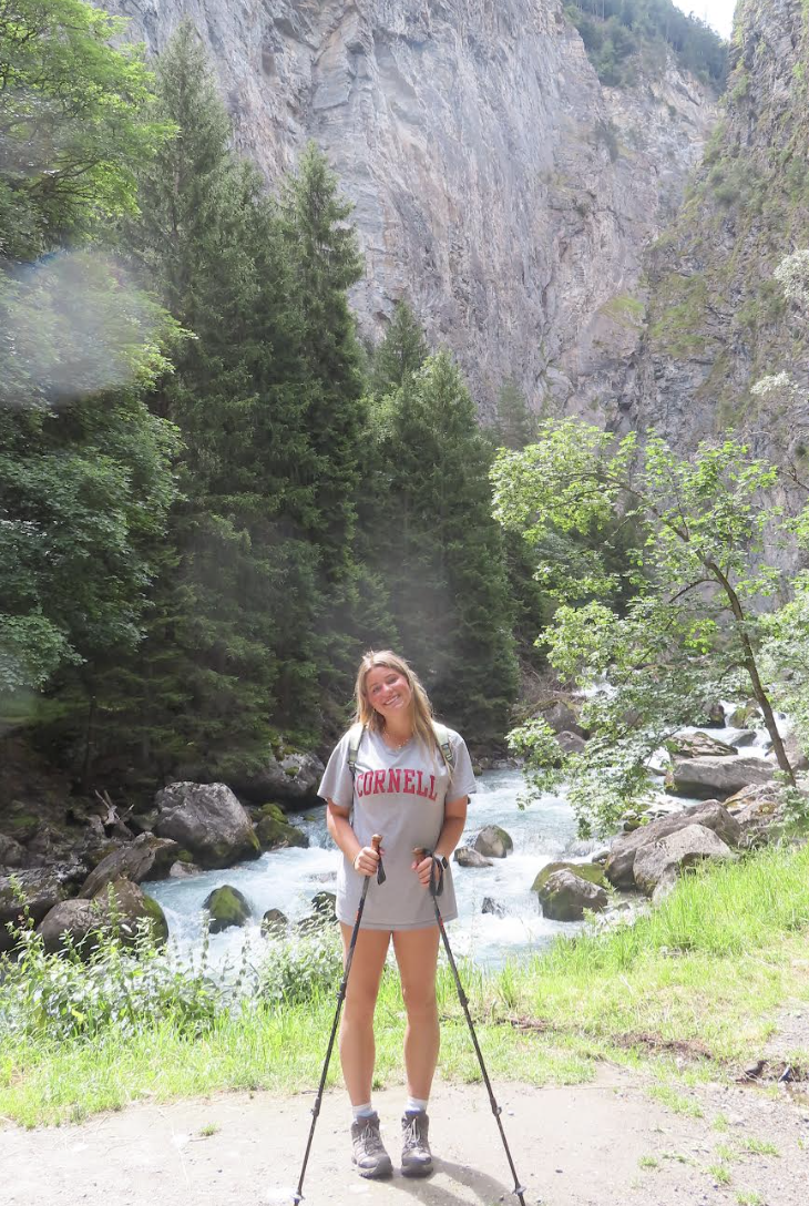 Jordan Dickson, one of our Outdoor Odyssey coordies, is pictured here beside a waterfall on a cliff!