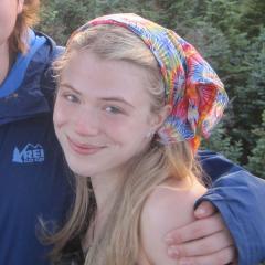 Photo of Isabella Hackett on top of a mountain smiling