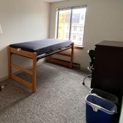 View of a bed in a bedroom at 301 College Avenue