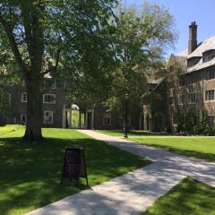 Exterior view of Balch Hall with green grass and trees