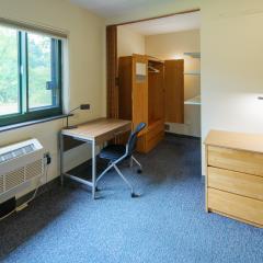 The closet area in a bedroom in Ecology House.