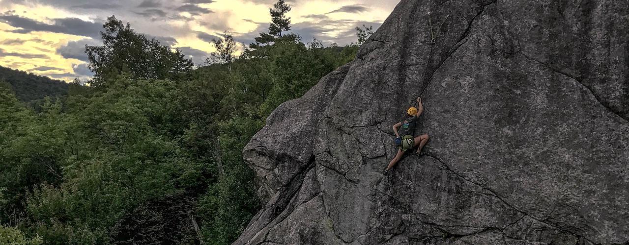 An Outdoor Odyssey pre-orientation tripper rock climbing in the Adirondacks