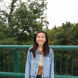 Image of student on north campus bridge