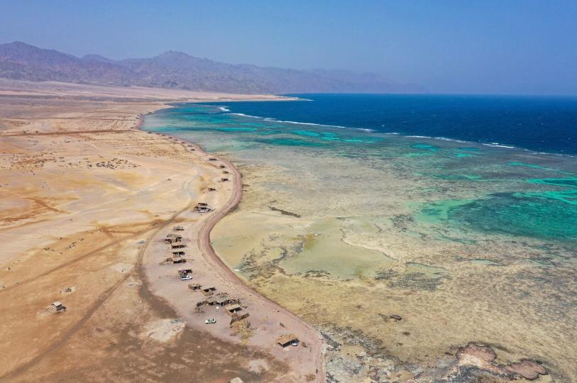 aerial shot of sinai with ocean and sand