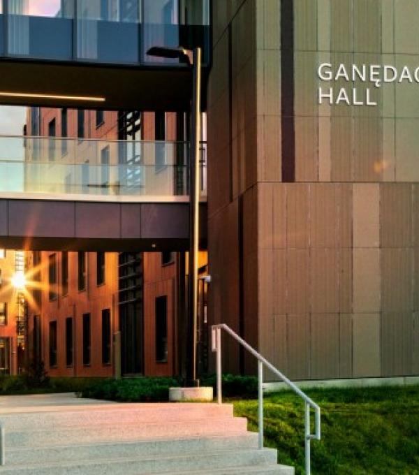 Exterior of Ganedago: Hall with sunshine reflecting against glass