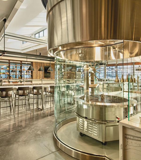 The Morrison Dining plancha grill station, featuring a circular grill behind glass