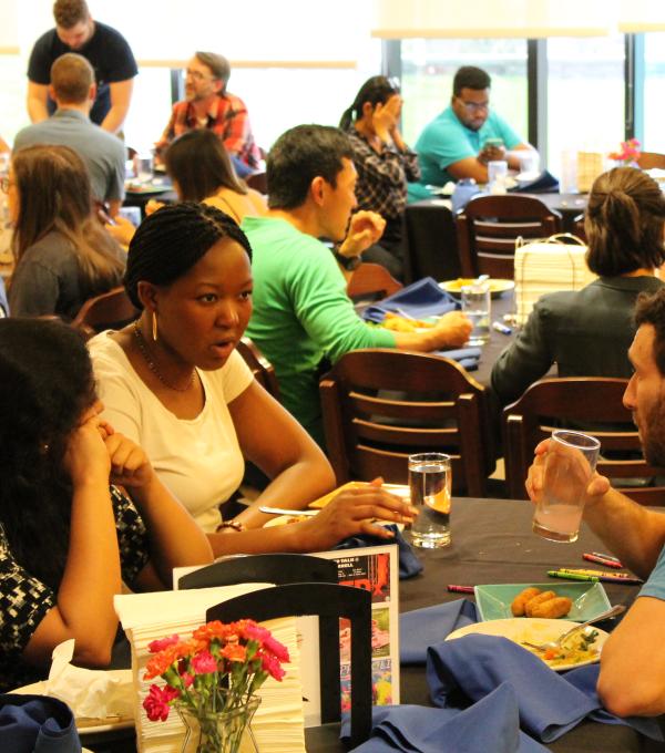 Students around campus dining room tables
