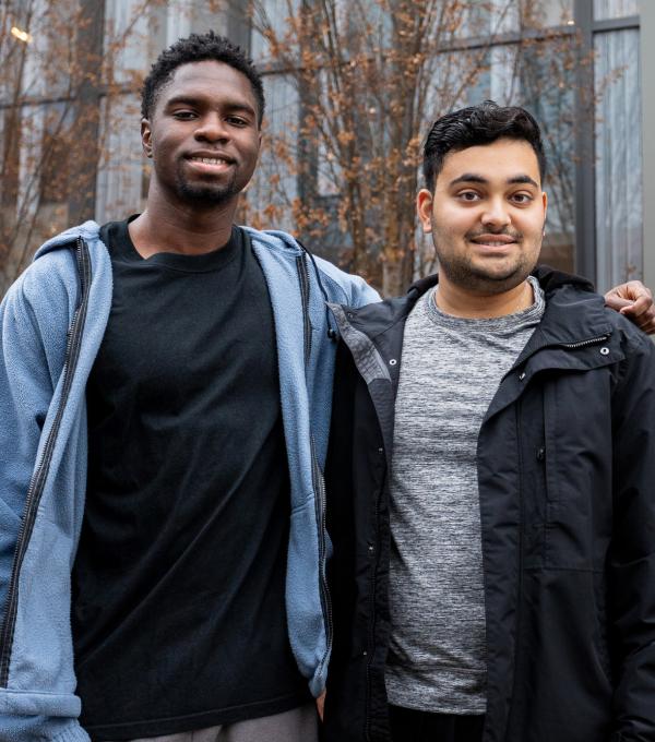 Students pose in front of Toni Morrison Hall