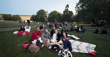 Students getting ready to enjoy a Cornell tradition: Movies on the Arts Quad!