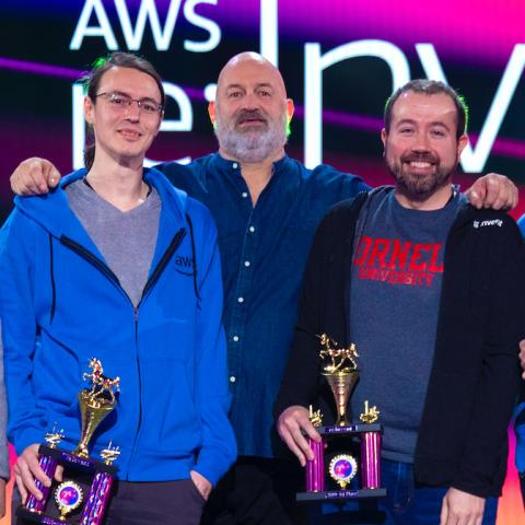 Tad Merchant, Dr. Werner Vogels (Chief Technology Officer, AWS) and Eric Grysko receiving the AWS GameDay award