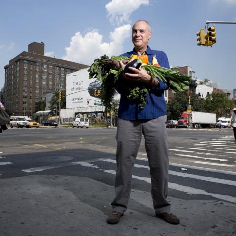 Mark Bittman holding vegetables
