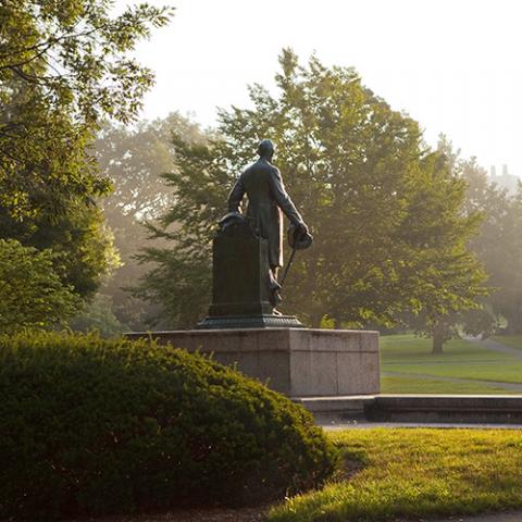 Back of Ezra Cornell statue looking into Arts Quad