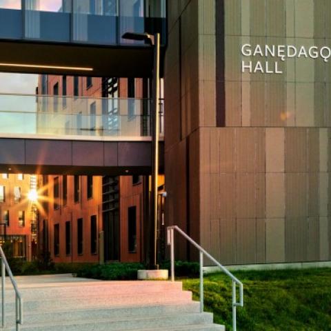 Exterior of Ganedago: Hall with sunshine reflecting against glass