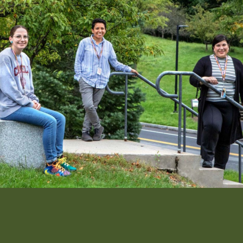 Three Community Response Team members stand outside on North Campus