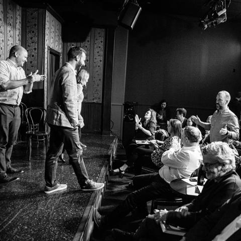 Second City improvisors talk with audience members