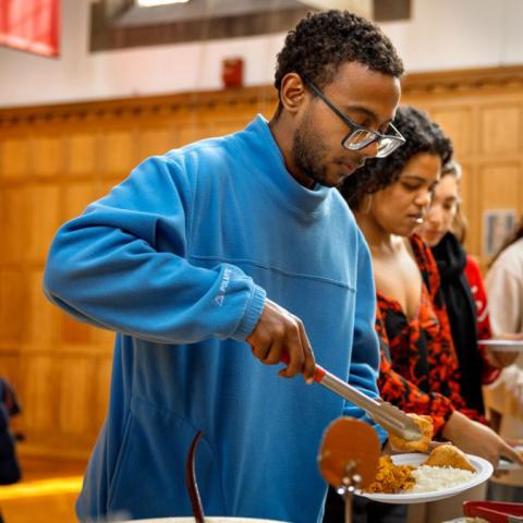 Photo of students in line getting food 