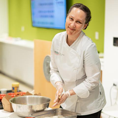 Chloe Greenhalgh prepares to teach a cooking class at the College of Veterinary Medicine