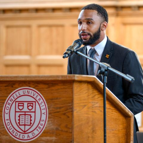 Master’s degree student Cameron White ’24 accepts the 30th annual James A. Perkins Prize for Interracial and Intercultural Peace and Harmony, on behalf of Black Student Empowerment.