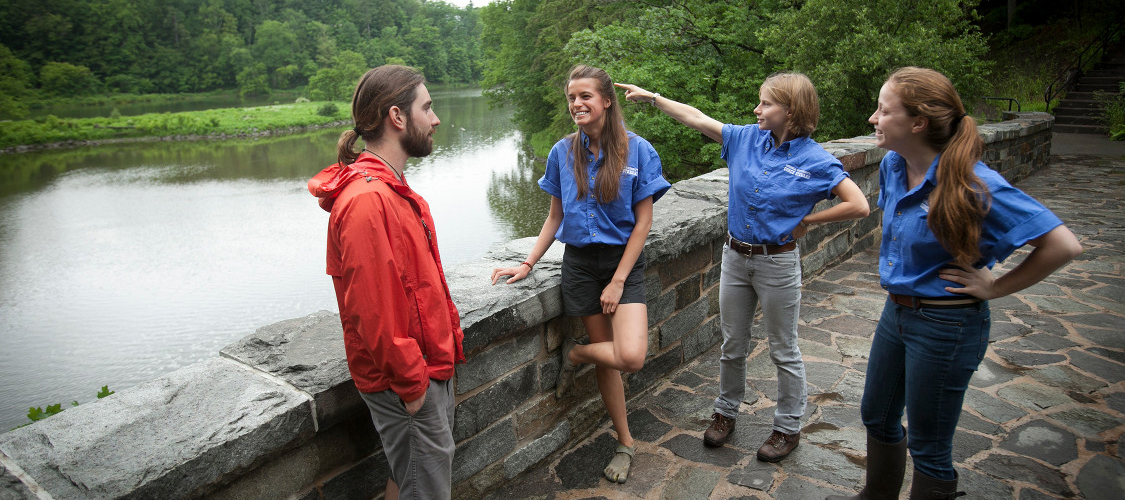 Gorge stewards give directions to a hiker at Beebe Lake