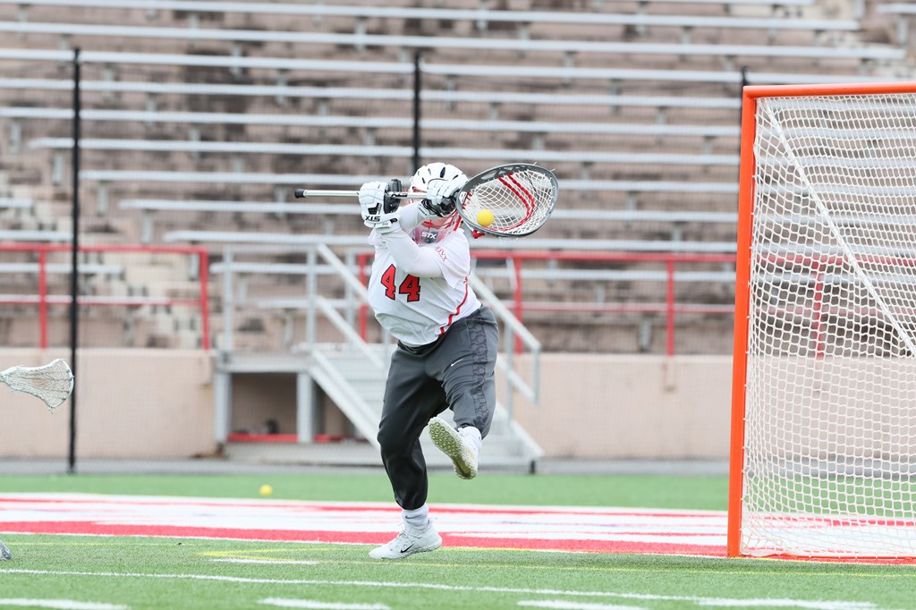 Katie McGahan '22 tends goal for the Cornell lacrosse team.