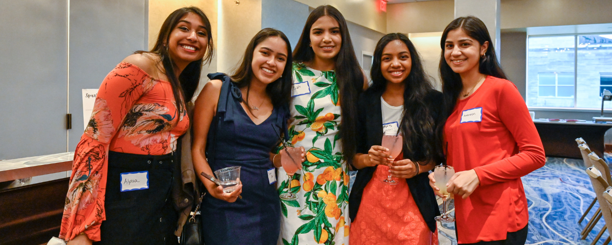 AC3 women posing at event.