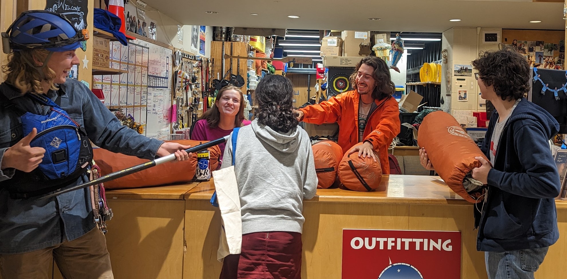 Students at the COE Outfitting desk renting and returning gear