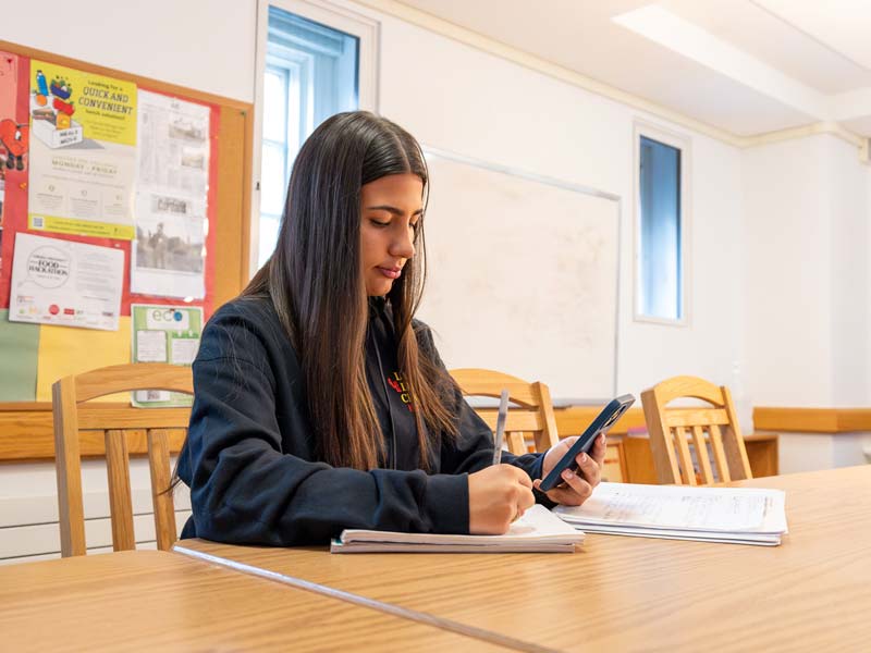 Maria Santa Studying in the Latino Living Center Common Room