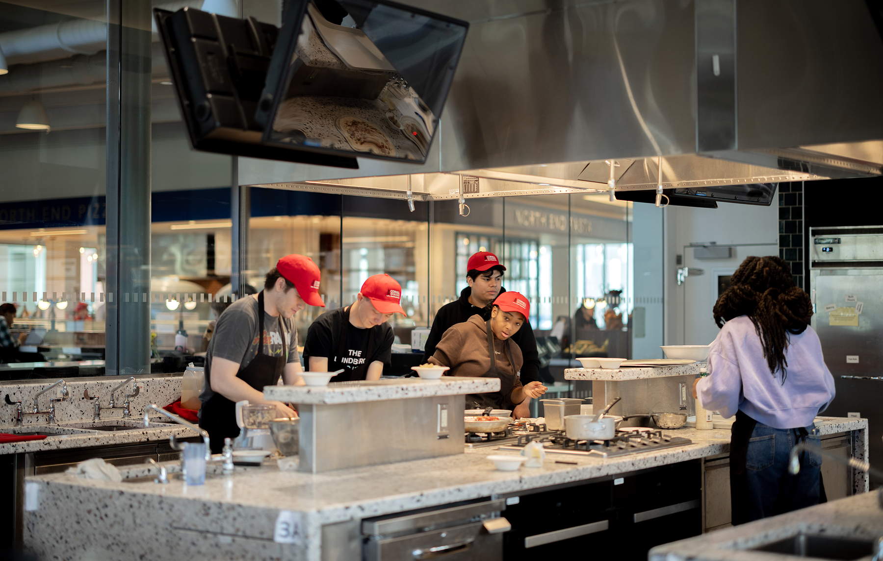 Students working at kitchen stations