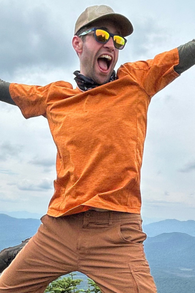 guy in sunglasses and orange shirt