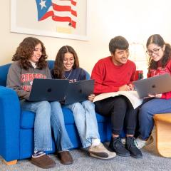 Residents of Latino Living Center working in their living room
